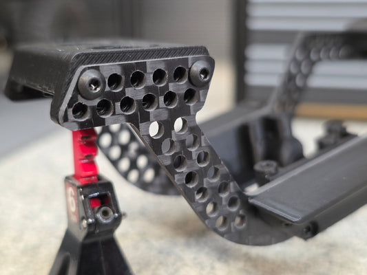 Black carbon chassis rail and black printed components close-up